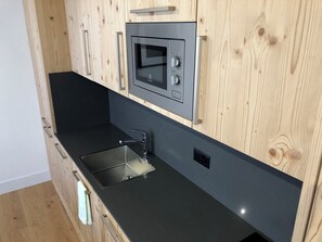 Fridge, microwave, cookware/dishes/utensils