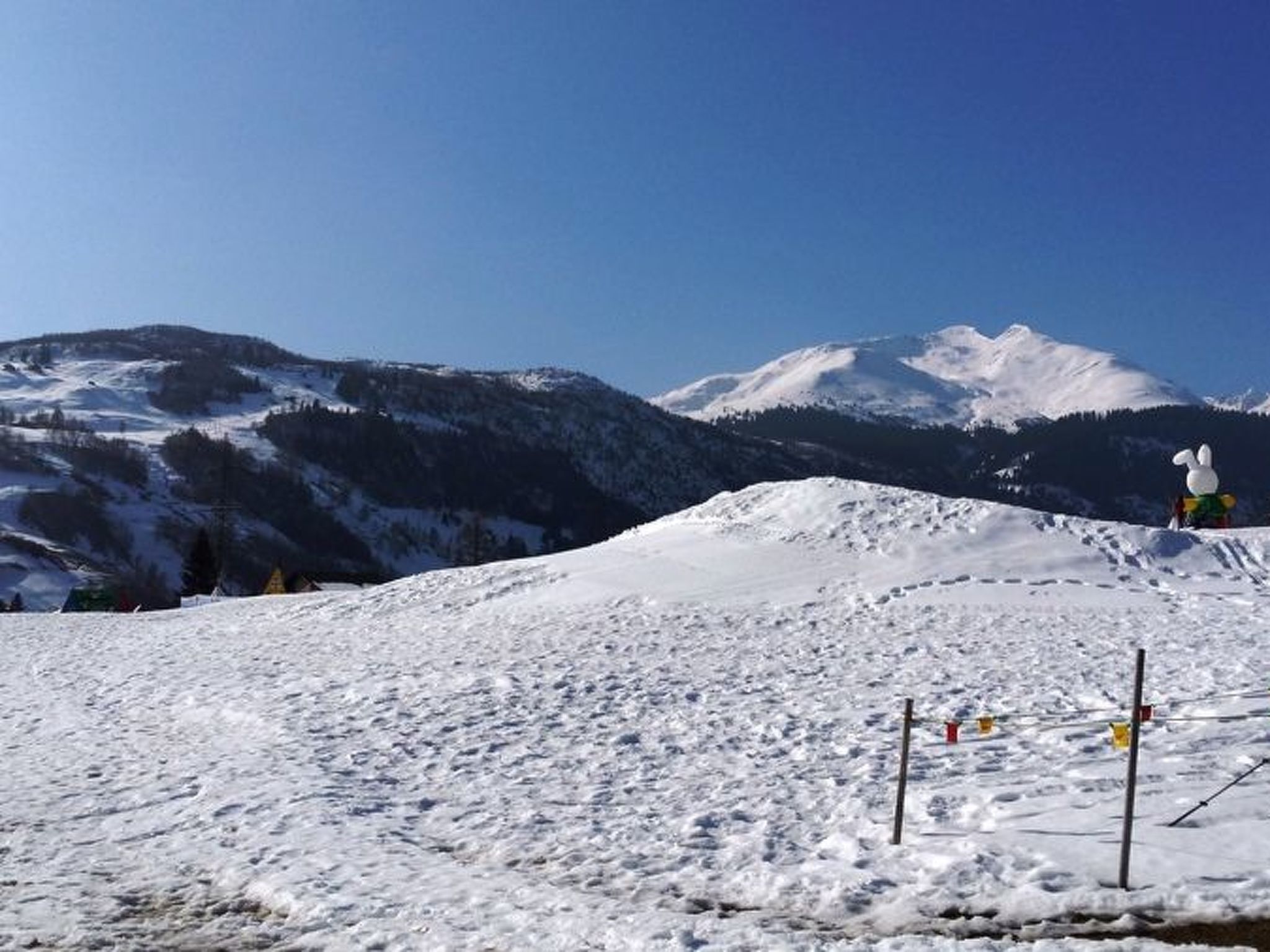 A snowy mountain landscape with a clear sky.