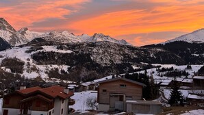 A mountain landscape with snow-covered peaks and a wooden building in the foreground. - Casa Diala Panorama, (Segnas/Disentis), 1106 by Interhome (Disentis)