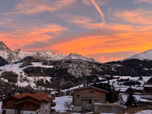 A mountain landscape with snow-covered peaks and a wooden building in the foreground. - Casa Diala Panorama, (Segnas/Disentis), 1106 by Interhome (Disentis)