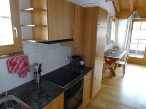 Fridge, oven, dishwasher, cookware/dishes/utensils - Tgèsa La Tscheppa A Vujevic, (Camischolas Sedrun). by Interhome (Camischolas)