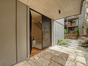 A modern building with a stone pathway leading to a door. - Apartment  by Interhome (Porto)