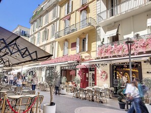 A hotel with outdoor seating, a restaurant, and a café. - Apartment  by Interhome (Cannes)