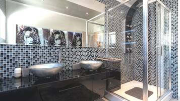 Shower, hair dryer, towels, toilet paper