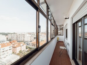 A narrow balcony with large windows overlooking a cityscape. - CITY CENTER GRAND SEA VIEW TERRACE by VACATIONY by Interhome (Porto)