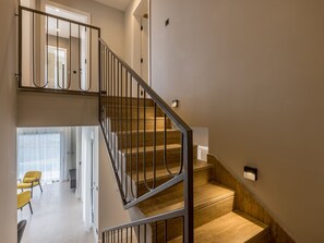 A multi-level interior with a staircase, a dining area, and a view of a room with a bed. - Beachfront villa Luce with seaview and pool by Interhome (Trstenik/Dingač)