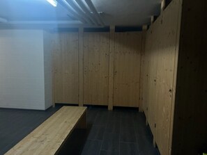 A room with wooden walls, a bench, and a tiled floor. - Alpatli, Obersaxen-Miraniga, (Obersaxen), 38095B by Interhome (Obersaxen Affeier)