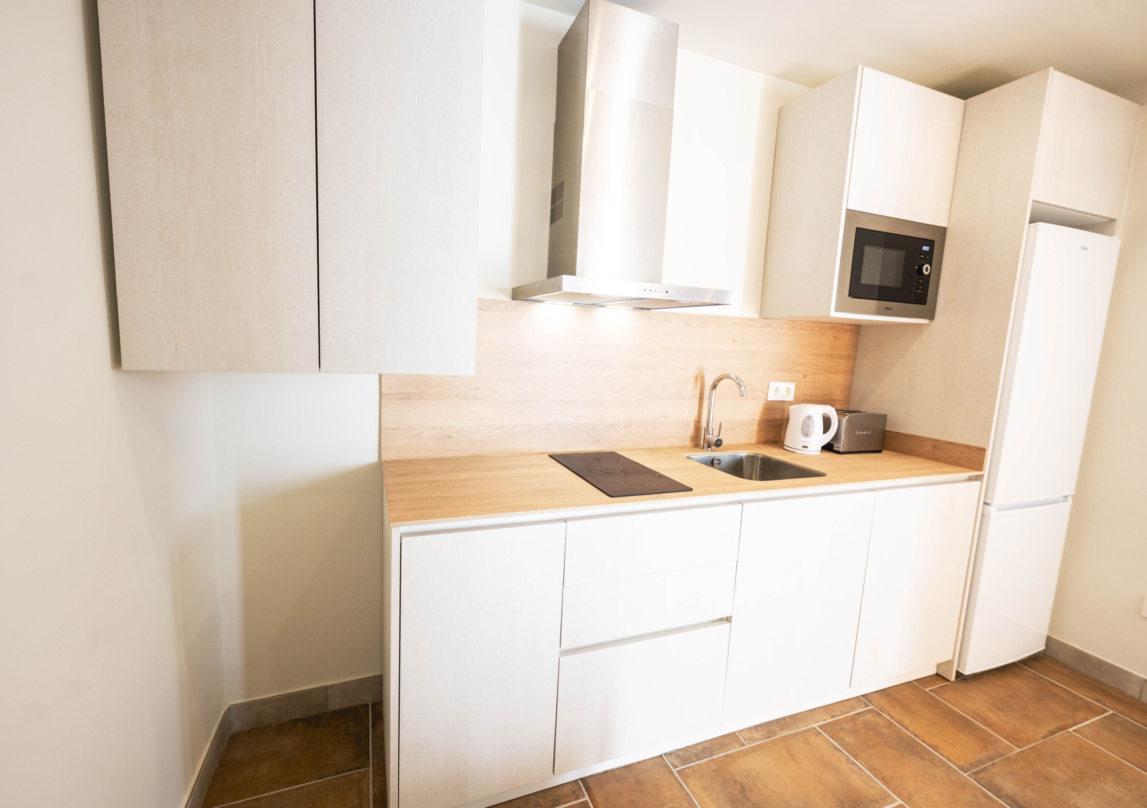 Fridge, microwave, coffee/tea maker, toaster