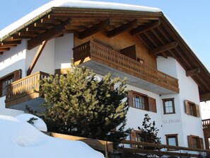 A multi-story building with a wooden balcony and a sign that reads 'LA PRADA'. - La Prada Seipel, Brigels, (Breil/Brigels), 65031B by Interhome (Breil/Brigels)
