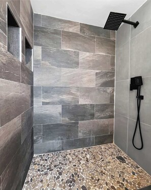 Shower, hair dryer, towels, shampoo