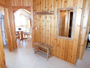 A wooden interior with a dining area, a bench, and a window. - Quadra Rohner, Degen, (Degen), 45008B by Interhome (Vattiz)