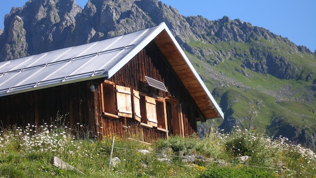 A wooden cabin with a sloped roof, set against a mountainous backdrop. - Tegia Veglia / Erlebnisalp Glivers, Sumvitg, (Sumvitg), 75002B by Interhome (Cumpadials)
