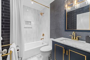 Shower, hair dryer, towels, shampoo