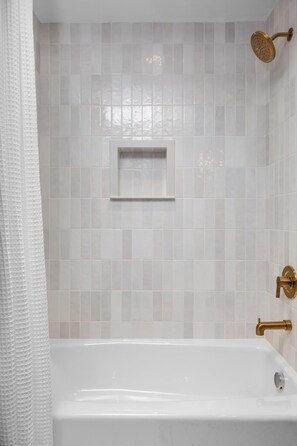 Shower, hair dryer, towels, shampoo