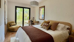 A bedroom with a bed, a chair, a desk, and a window. - Vacation home RALAYE by Interhome (Carces)