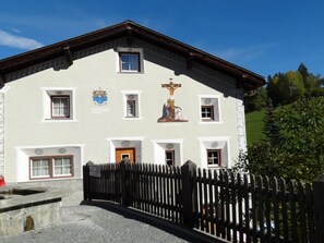 A building with a traditional architectural style, featuring a gabled roof and a series of windows. - Chasa Quadra, (Tarasp) by Interhome (Tarasp)