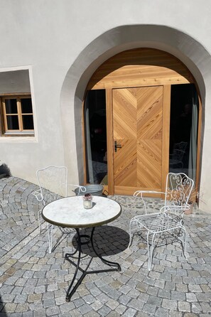 Outdoor dining - Stüvetta à Porta, (Scuol). by Interhome (Scuol)