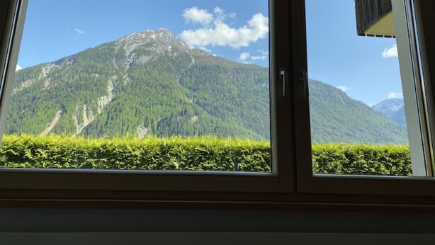 A window with a view of a mountain. - Leitner, (Ramosch) by Interhome (Ramosch)