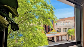 A view of a building with a marquee sign reading 'PARAMOUNT' and 'KENTUCKY DERBY FUNDRAISER' with a date of 'MAY 2'. - Huge Historic Loft on State Street!  2 bed - 2 Bath - With view of Downtown (Bristol)
