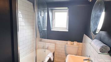 Shower, hair dryer, towels, shampoo