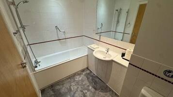 Shower, hair dryer, towels, shampoo