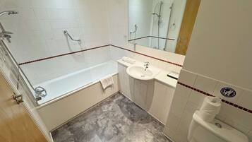 Shower, hair dryer, towels, shampoo