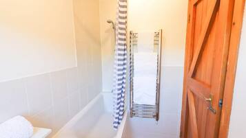 Shower, hair dryer, towels, shampoo