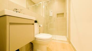 Shower, hair dryer, towels, shampoo