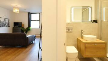 Shower, hair dryer, towels, shampoo