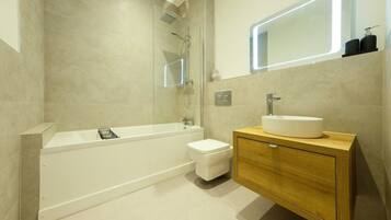 Shower, hair dryer, towels, shampoo