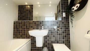 Shower, hair dryer, towels, shampoo
