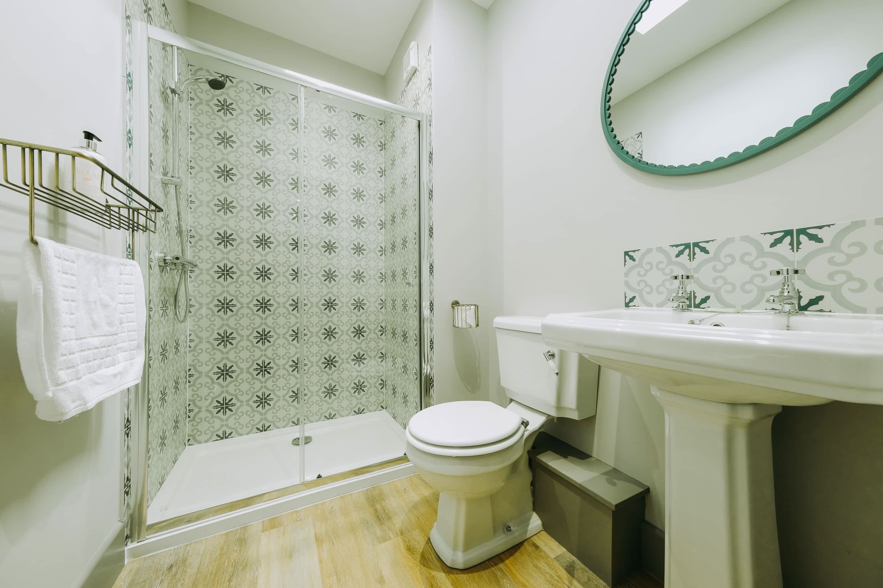 Shower, hair dryer, towels, shampoo