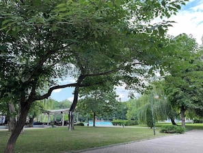 A park with trees, a gazebo, and a paved walkway. - 7Mins City Garden and Center+P (Plovdiv)