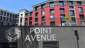 A building with 'POINT AVENUE' signage, featuring a modern architectural style with multiple balconies and large windows. - 7Mins City Garden and Center+P (Plovdiv)