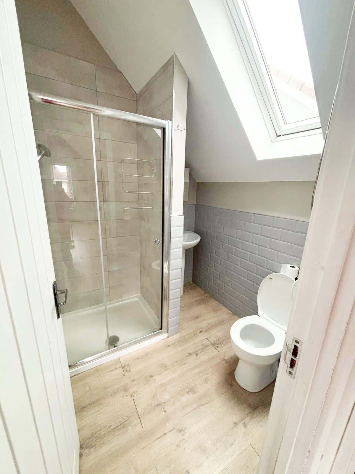 Shower, hair dryer, towels, shampoo