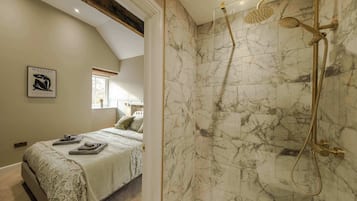 Shower, hair dryer, towels, shampoo