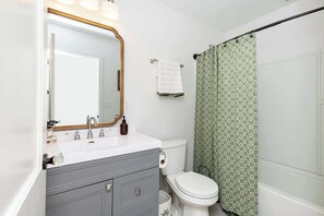 Shower, hair dryer, towels, shampoo
