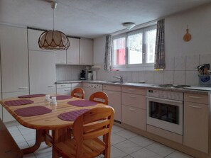 Fridge, oven, dishwasher, cookware/dishes/utensils - Ferienwohnungen Jörihus A&B, (Medels). by Interhome (Splügen)