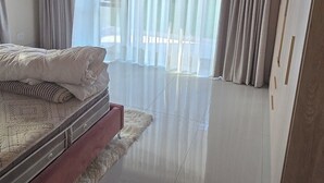A bedroom with a bed, a ceiling fan, a window with curtains, and a wooden ceiling. - Fantastic 4-bedroom house in pleasant Gillitts for your getaway (Gillitts)