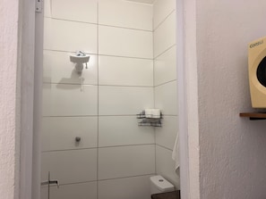 Shower, hair dryer, towels, toilet paper