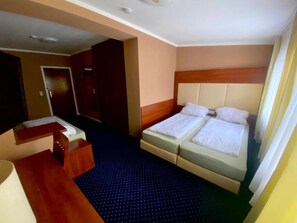 Family Triple Room, City View | Desk, laptop workspace, free WiFi