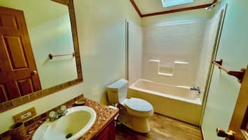 Jetted tub, soap, toilet paper