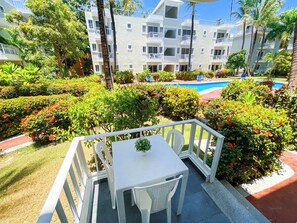 Deluxe Studio Suite, Air conditioning, Pool View | Outdoor dining - TROPICANA PALMS Suites & Studios (Punta Cana)
