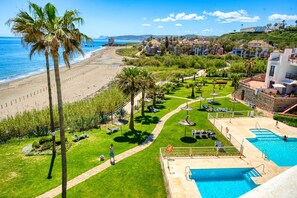 A resort with a pool, a beach, and a view of the ocean. - 3180 Duplex Penthouse with Panoramic Sea Views (Casares)
