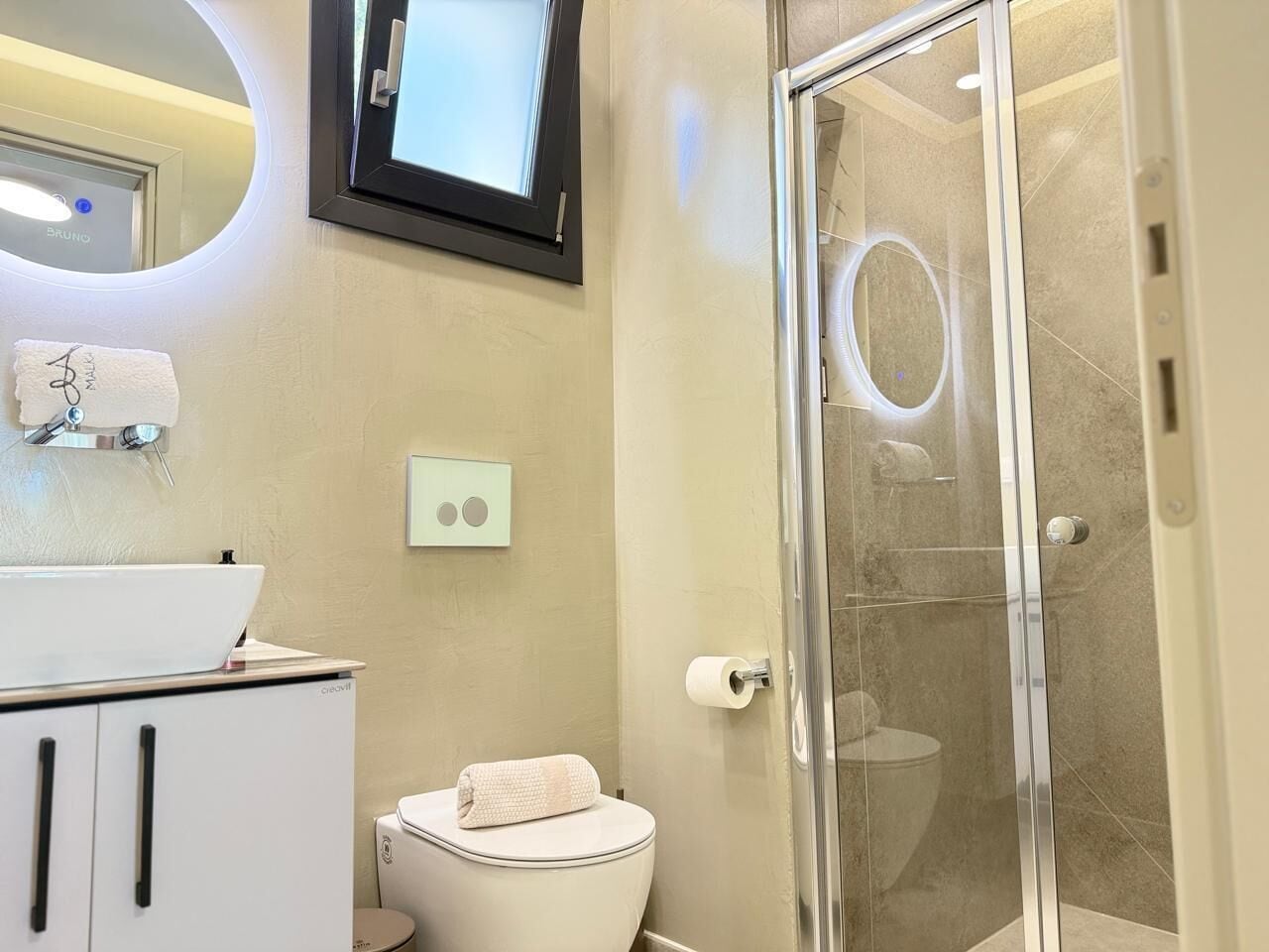 Shower, hair dryer, slippers, towels