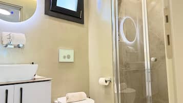 Shower, hair dryer, slippers, towels