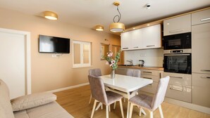 A modern kitchen with white cabinets, a built-in oven, and a microwave. - Luxury Flat in Split City Center 15 min walk from Ferry Port and Beach (Split)