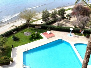 A swimming pool with a view of the beach and ocean. - APARTAMENTO CABO AZUL by Interhome (El Campello/Villajoyosa)