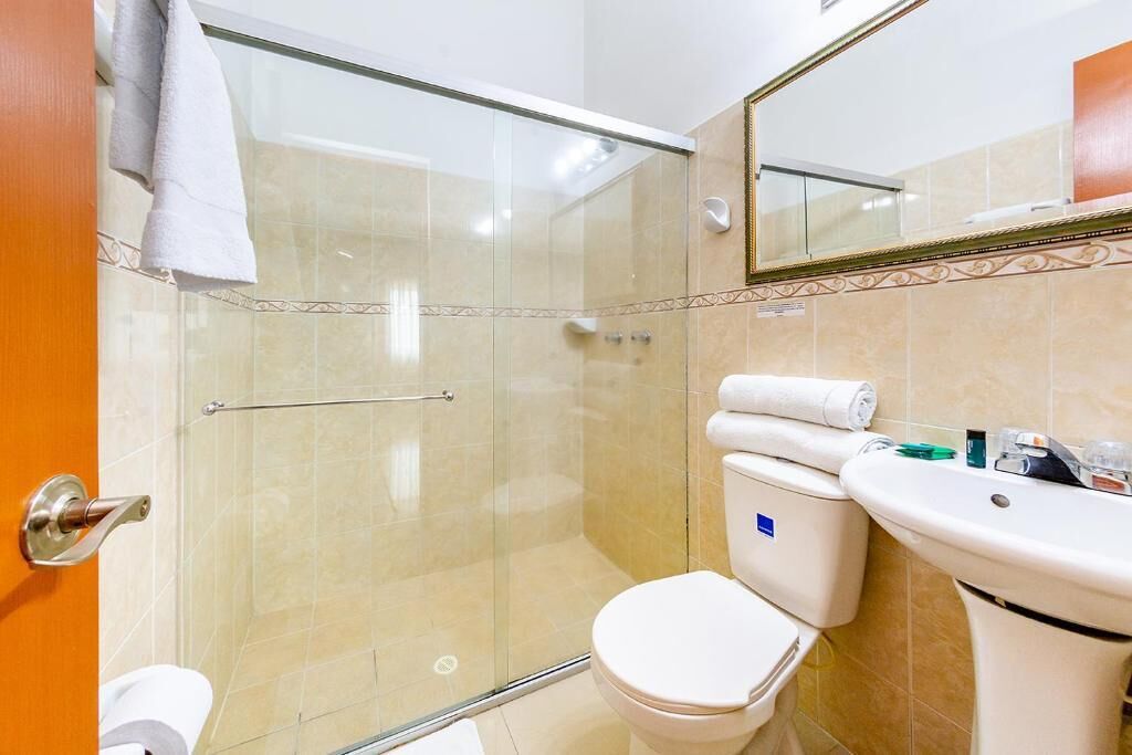 Deluxe Quadruple Room, City View | Bathroom | Shower, towels, toilet paper