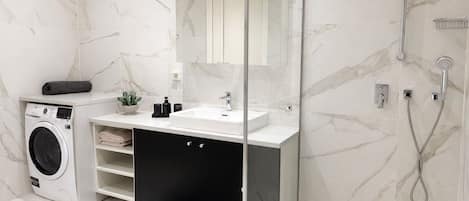 Shower, hair dryer, towels, soap